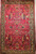 Vintage Persian Kerman Lavar in "Tree of Life" pattern with floral design set in an ivory color field from the first half of the 20th century.  There are several beautiful designs that are incorporated in this rug including a row of cypress trees on the lower part of the rug.  Also the range of the colors in the design include green, gold, blue, and red.  The corner spandrels on the upper section of the design are in a bright red color with floral design.  The primary border is also in ivory color with flowers and tree designs throughout.