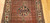 Antique Persian Malayer rug, Hamadan weaving, with paisley and medallion design on brick-red field and cream border, early 1900s.