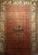 Antique Persian Malayer rug, Hamadan weaving, with paisley and medallion design on brick-red field and cream border, early 1900s.