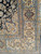Extremely rare mid-century Persian Nain rug with silk floral medallion design in dark blue with silk highlights.