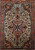 19th century Persian Farahan Sarouk area rug in saffron yellow with blue medallion and rust floral border