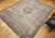Late 19th Century Antique Persian Kerman Lavar area rug. Handwoven. Rare near-square size. Floral central medallion on ivory background. Scrolling vines and flowers in black and red throughout field. Five borders with floral designs in black, red, and cream. Weaver's signature in top border.