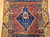 19th century Anatolian Turkish village rug with blue medallion on brick-red field and yellow geometric border, The Persian Knot Gallery, SKU: 1595