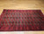 Antique Turkmen Rug | Gul Pattern, Deep Red | In-Room View 7
