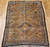 Vintage Moroccan camel hair rug with large tribal diamond motifs and earth-tone palette, circa mid-20th century.
