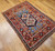 Vintage Anatolian prayer rug in purple and blue with geometric brick-red border, handwoven with natural dyes, The Persian Knot Gallery, SKU: 1588