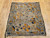 Antique 19th-century Caucasian Kazak bagface with geometric squares in blue, brown, and red. Small tribal rug for wall display or textile collection.