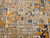 Antique 19th-century Caucasian Kazak bagface with geometric squares in blue, brown, and red. Small tribal rug for wall display or textile collection.