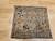 Antique 19th-century Caucasian Kazak bagface with geometric squares in blue, brown, and red. Small tribal rug for wall display or textile collection.