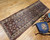 Late 19th Century Antique Persian Kurdish Bidjar runner. Hand-knotted. All-over "Mina Khani" rosettes pattern. Colorful flowers on abrash blue field. White border. Traditional village weave.