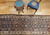 Late 19th Century Antique Persian Kurdish Bidjar runner. Hand-knotted. All-over "Mina Khani" rosettes pattern. Colorful flowers on abrash blue field. White border. Traditional village weave.