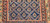 Late 19th Century Antique Kurdish gallery-size rug. Hand-woven. Paisley pattern. Blue background. Predominantly rust-colored border. Ideal for a hallway or as a wide runner.