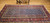 Late 19th Century Antique Kurdish gallery-size rug. Hand-woven. Paisley pattern. Blue background. Predominantly rust-colored border. Ideal for a hallway or as a wide runner.