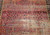 Early 19th Century Antique Agra area rug. Handwoven. Over 200 years old. Good condition. All-over floral pattern in Mughal tradition. Magenta-red field. Purple or eggplant color border. Rare square size.