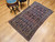 Early 20th Century Vintage Persian Senneh area rug. Hand-knotted. All-over "Herati" pattern on abrash navy blue background. Extremely fine weave, high knot density. French blue border with geometric pattern. Accent colors: red, yellow, ivory.
