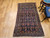 Early 20th Century Vintage Persian Senneh area rug. Hand-knotted. All-over "Herati" pattern on abrash navy blue background. Extremely fine weave, high knot density. French blue border with geometric pattern. Accent colors: red, yellow, ivory.
