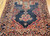 Antique Persian Farahan gallery rug with terracotta medallions on navy blue field and geometric border, late 19th century handwoven rug. The Persian Knot Gallery, SKU 1005