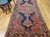 Antique Persian Farahan gallery rug with terracotta medallions on navy blue field and geometric border, late 19th century handwoven rug. The Persian Knot Gallery, SKU 1005