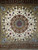Rare square Tabriz rug featuring a cream field, chocolate and dark red borders, silk highlights, and a central medallion—handwoven in one of Tabriz’s finest workshops.