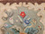 Early American hand-hooked floral rug from New England in rich vintage colors with a brown border, suitable as decorative wall art, The Persian Knot Gallery, SKU: 1451