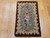 Early American hand-hooked floral rug from New England in rich vintage colors with a brown border, suitable as decorative wall art, The Persian Knot Gallery, SKU: 1451