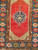 Late 1800s Turkish Anatolian rug with navy blue medallion, red background, tan field, and dark blue geometric border, The Persian Knot Gallery, SKU: 1591