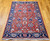 Vintage Turkish Mahal Sultanabad rug with brick-red field, navy border, and bold geometric allover design