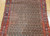 Antique Persian Kurdish Bidjar camelhair gallery rug with allover paisley boteh pattern in red blue and brown on natural camel background, The Persian Knot Gallery, SKU 1533