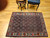 Vintage Persian Senneh area rug. Hand-knotted. All-over Herati design on dark blue field. "Gol Farang" border (French Aubusson style floral design) on abrash light blue/green background. Fine tight weave. From Senneh, Persia.