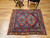 19th century Anatolian Turkish rug with Kazak Eagle medallions on blue field and red, navy, and yellow border, The Persian Knot Gallery, SKU: 1593