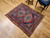 19th century Anatolian Turkish rug with Kazak Eagle medallions on blue field and red, navy, and yellow border, The Persian Knot Gallery, SKU: 1593