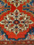 19th century Anatolian Turkish rug with Kazak Eagle medallions on blue field and red, navy, and yellow border, The Persian Knot Gallery, SKU: 1593