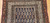 Antique Persian Malayer rug with allover paisley design on navy-blue field, early 20th century.