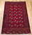 Antique Turkmen Rug 2x3 | Gul Pattern, Deep Red | Full View on Floor