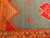 Vintage Moroccan area rug with geometric medallion in aqua green, saffron yellow border, and red-brown accents.