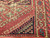 Antique near-square Turkish Village rug with geometric medallion design in terracotta, ivory, turquoise, and green on natural wool.