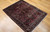 Antique Persian Sarouk rug with floral design on burgundy field and ivory, navy, and green accents, The Persian Knot Gallery, SKU 1034