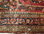 Antique Persian Sarouk rug with floral design on burgundy field and ivory, navy, and green accents, The Persian Knot Gallery, SKU 1034