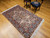 Vintage Persian Kerman Lavar rug with rare silk highlights. Ivory ground with multicolor floral motifs in pink, blue, green & yellow.