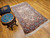Vintage Persian Kerman Lavar rug with rare silk highlights. Ivory ground with multicolor floral motifs in pink, blue, green & yellow.