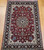 Antique Persian Tabriz rug in Shah Abbas design with pomegranate-red field, navy blue border, and silk highlights, The Persian Knot Gallery, SKU: 1207