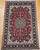 Antique Persian Tabriz rug in Shah Abbas design with pomegranate-red field, navy blue border, and silk highlights, The Persian Knot Gallery, SKU: 1207