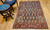 Antique Kurdish rug with paisley motifs and colorful red border with abrash from natural dyes, The Persian Knot Gallery, SKU 1048, 4’ x 6’ 4”, 4th Quarter of the 1800s