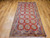 Antique East Turkestan Khotan Rug | Pomegranate | Full View on Floor