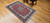 Antique Persian Tabriz rug in Shah Abbas design with pomegranate-red field, navy blue border, and silk highlights, The Persian Knot Gallery, SKU: 1208