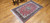 Antique Persian Tabriz rug in Shah Abbas design with pomegranate-red field, navy blue border, and silk highlights, The Persian Knot Gallery, SKU: 1208