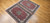 Antique Persian Tabriz rug in Shah Abbas design with pomegranate-red field, navy blue border, and silk highlights, The Persian Knot Gallery, SKU: 1208