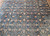 Early 20th Century Vintage Oversize Persian Mahal Sultanabad carpet. Hand-woven. All-over pattern with small medallions and flower heads alternating in columns, connected by curved branches and leaves. Dark navy blue primary field. Dark burgundy border.