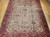 Late 19th Century Antique Persian Ziegler Mahal Sultanabad room size rug. Hand-woven. Rare camelhair or pale saffron yellow background. All-over large scale geometric pattern connected by scrolling lines. Designs in camelhair, navy blue, turquoise blue, green, red, pink, yellow. Red border with geometric designs and scrolling lines/branches.