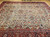 Late 19th Century Antique Persian Ziegler Mahal Sultanabad room size rug. Hand-woven. Rare camelhair or pale saffron yellow background. All-over large scale geometric pattern connected by scrolling lines. Designs in camelhair, navy blue, turquoise blue, green, red, pink, yellow. Red border with geometric designs and scrolling lines/branches.